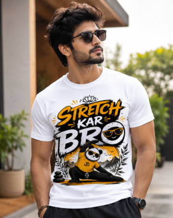 Man wearing a white graphic t-shirt with bold orange and black letters, sunglasses, standing outdoors.