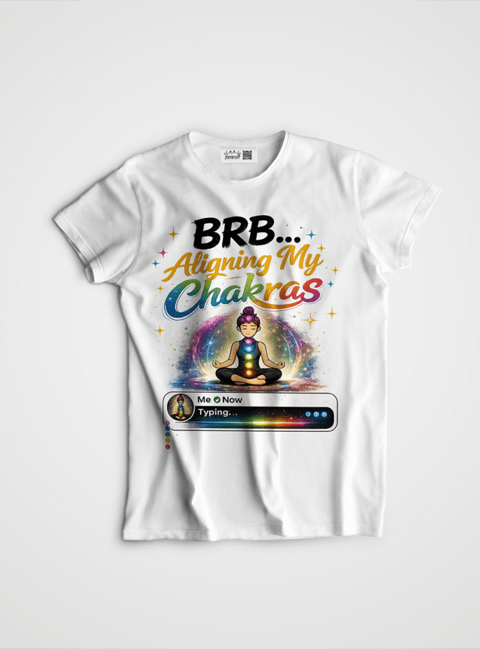 White T-shirt featuring a colorful graphic: 'BRB… Aligning My Chakras' with a meditating figure and a chat-style status bar reading 'Me Now. Typing…'