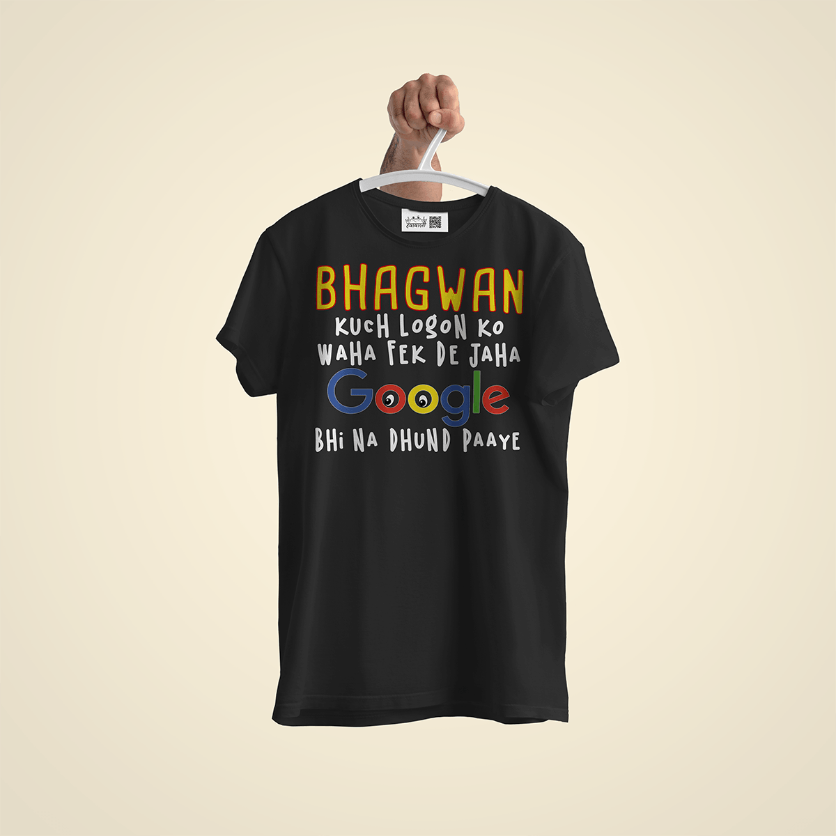 Black T-shirt on a hanger with colorful text reading 'BHAGWAN', 'kuch logon ko waha fek de jaha', Google logo, and 'Bhi na dhund paaye'