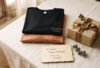 Personalized-birthday-gift-India-flat-lay-with-custom-printed-tees,-gift-box-and-card-in-black,-rust-and-gold-tones-Hawabazi
